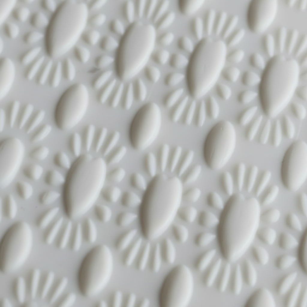 Close-up of a textured white surface with a geometric pattern