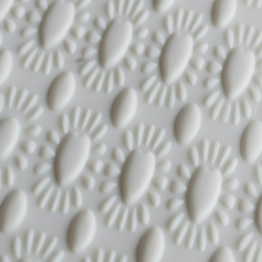 Close-up of a textured white surface with a geometric pattern