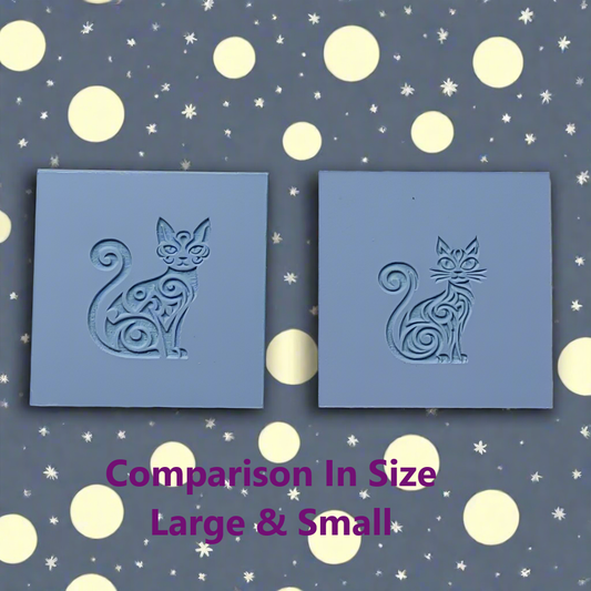 Two blue square stamps with cat designs on a patterned background