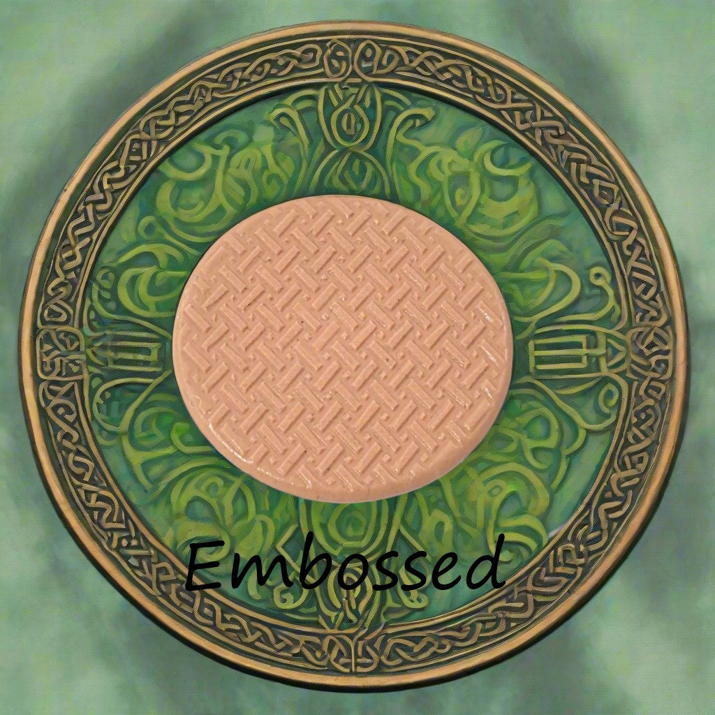 Celtic design debossed in silly putty Using an embossed texture mat. This will give you an idea of what it will look like on metal clay or polymer clay