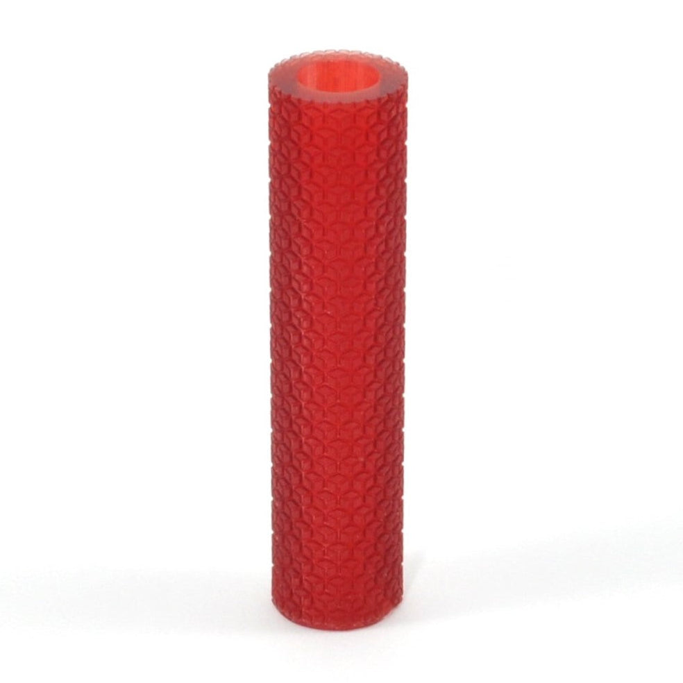 Red textured cylindrical object on a white background