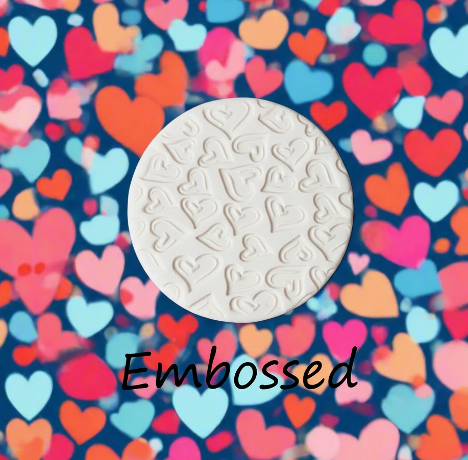 Confetti Hearts debossed in clay. This will give you an idea of what it will look like on metal clay or polymer clay