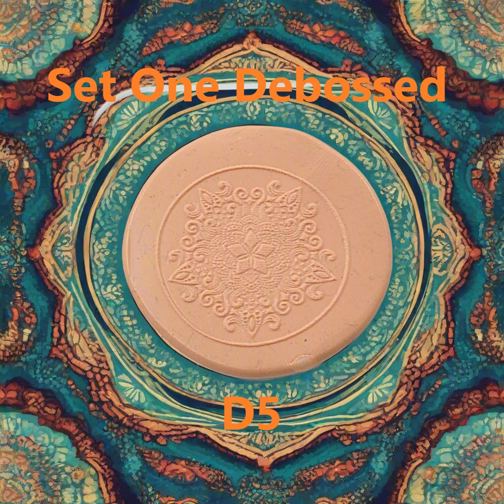 A mandala pattern embossed in silly putty using an debossed texture mat. This will give you an idea of what it will look like on metal clay or polymer clay.