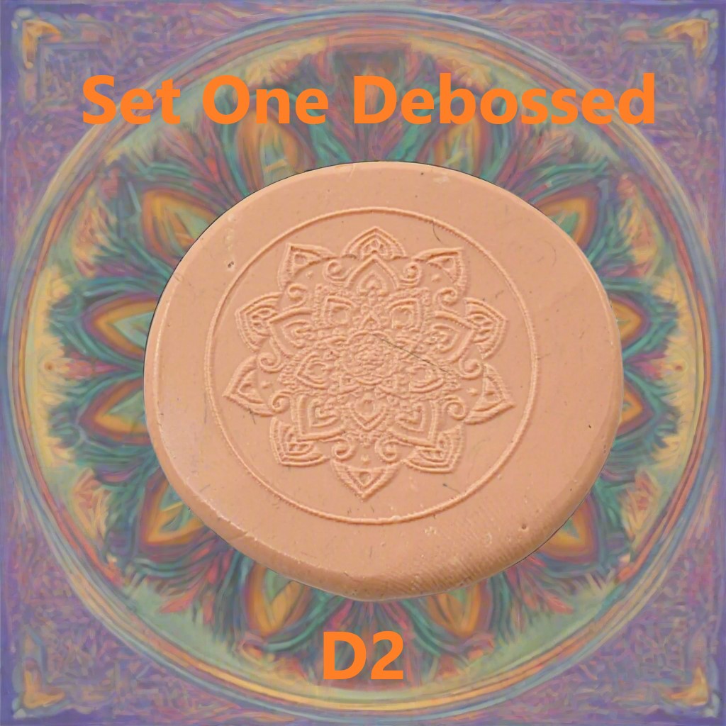 A mandala pattern embossed in silly putty using an debossed texture mat. This will give you an idea of what it will look like on metal clay or polymer clay.