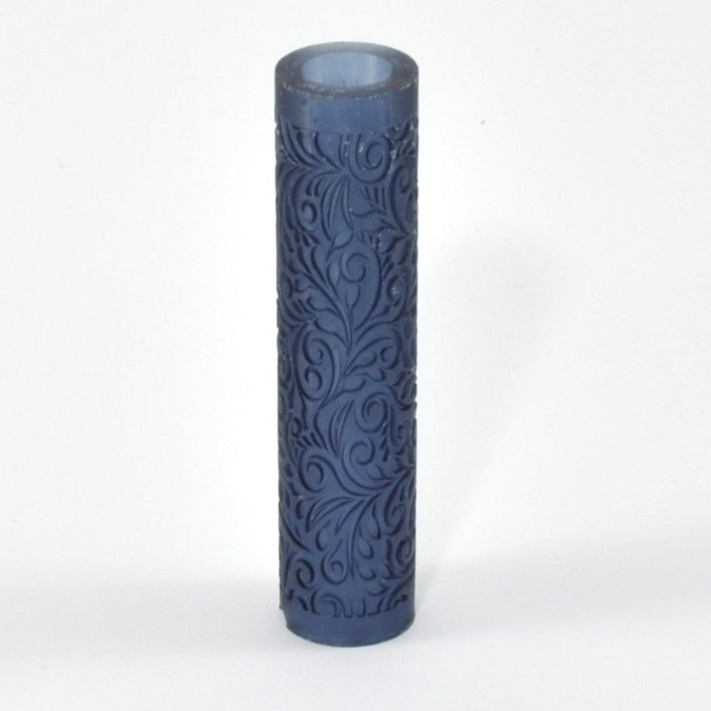Decorative cylindrical roller with embossed pattern on a white background