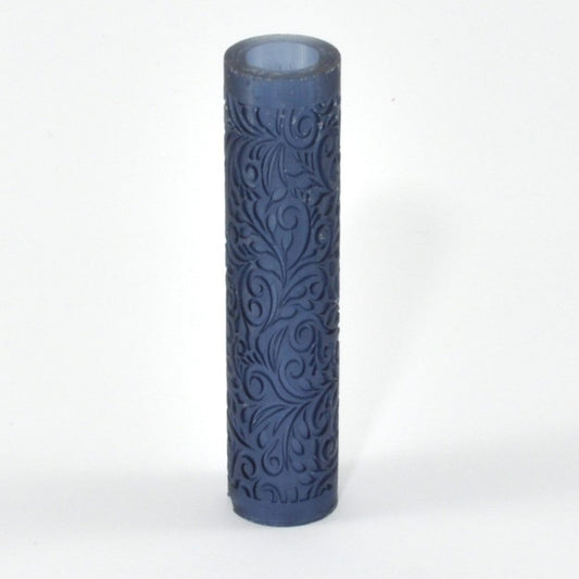 Decorative cylindrical roller with embossed pattern on a white background