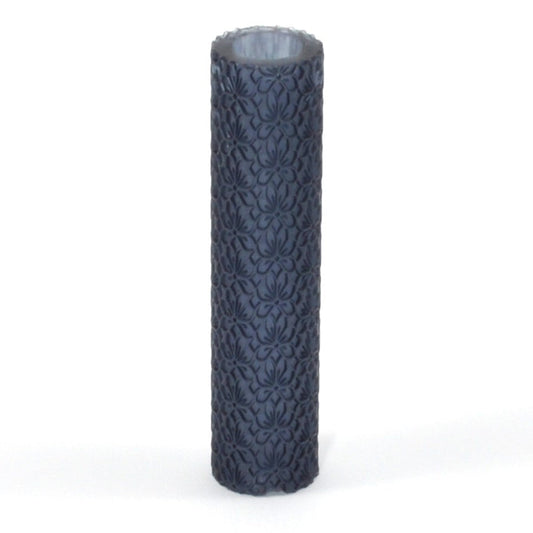 Decorative cylindrical roller with intricate pattern on a white background