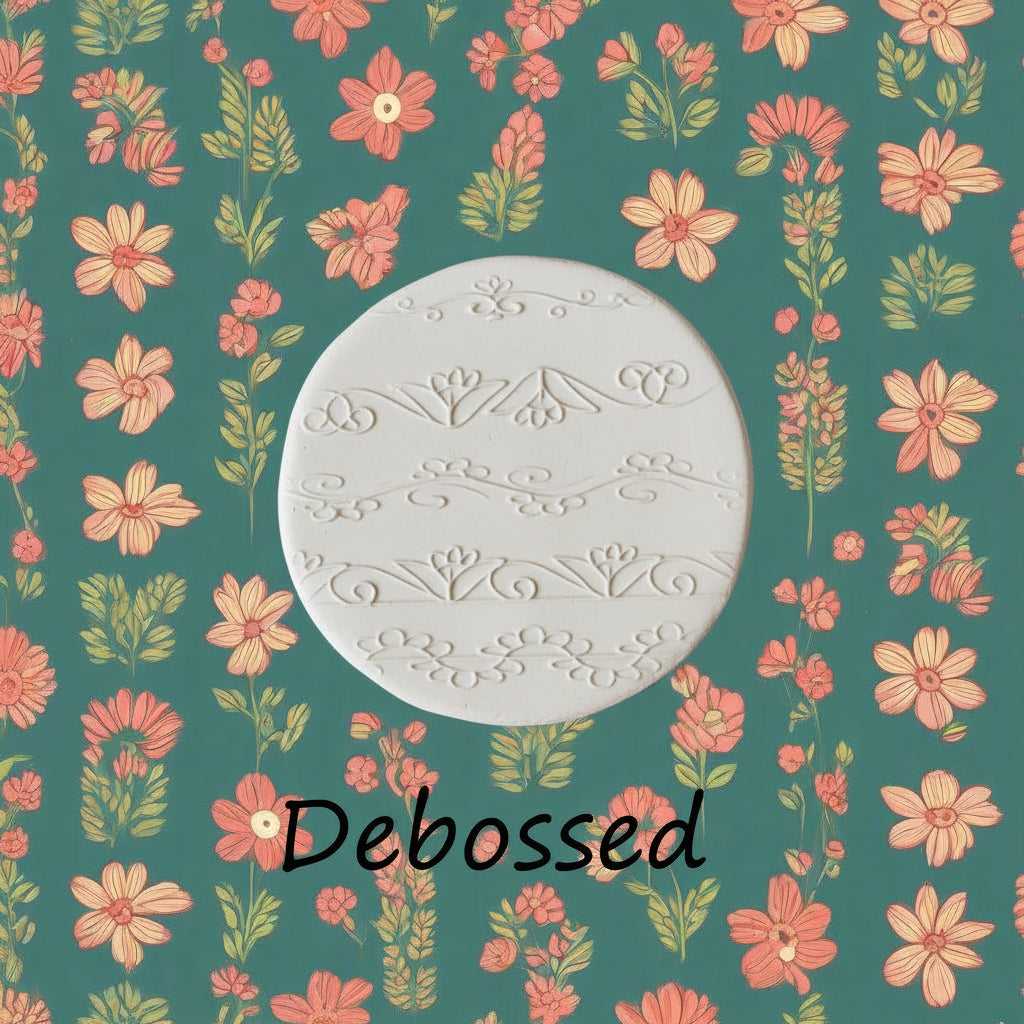 flowery patterns embossed in clay using a debossed texture mat.