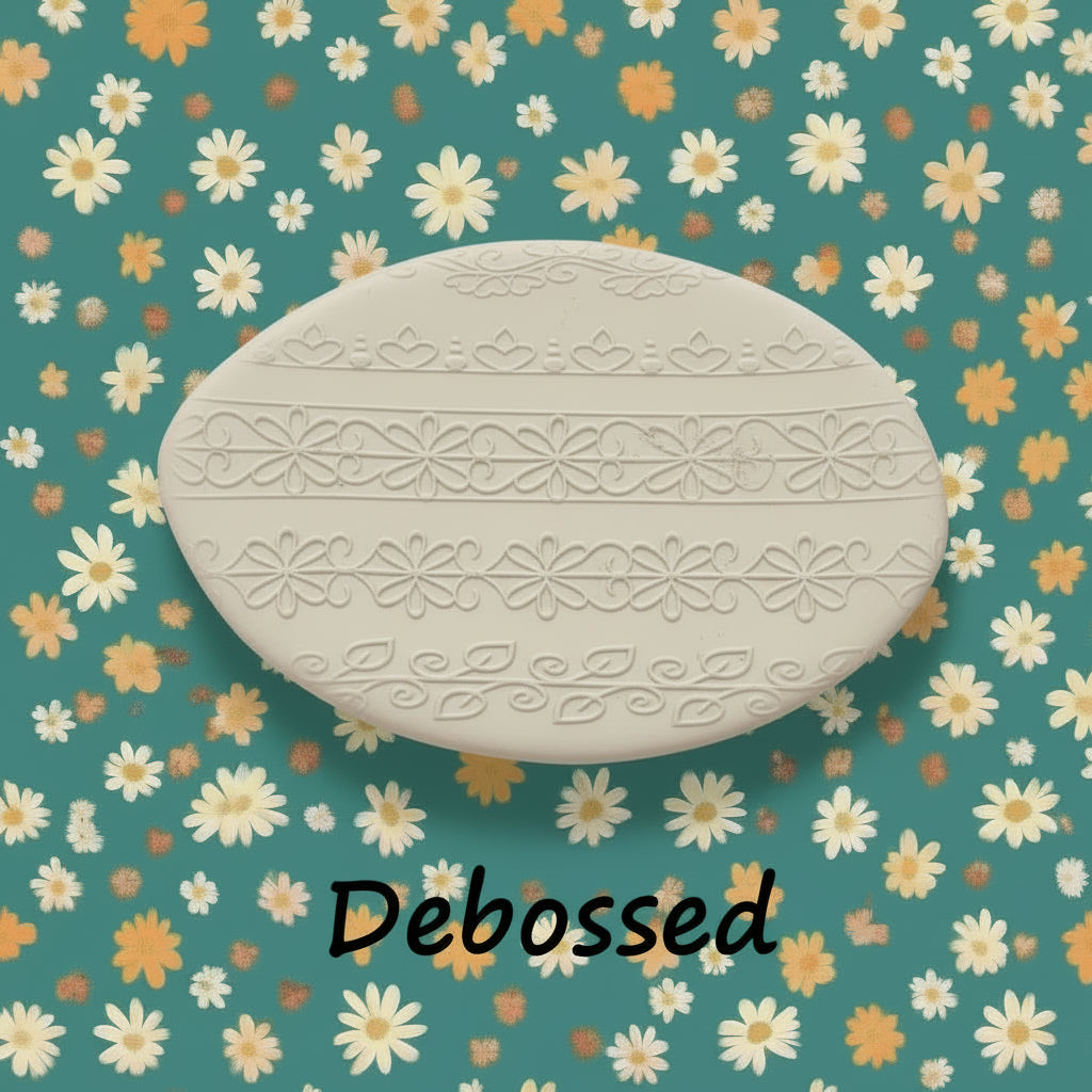flowery patterns embossed in clay using a debossed texture mat.