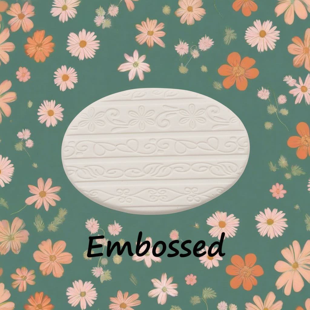 flowery patterns debossed in clay using an embossed texture mat.