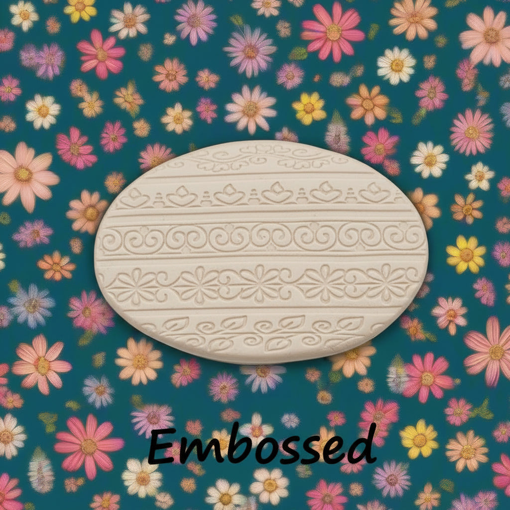flowery patterns debossed in clay using an embossed texture mat.