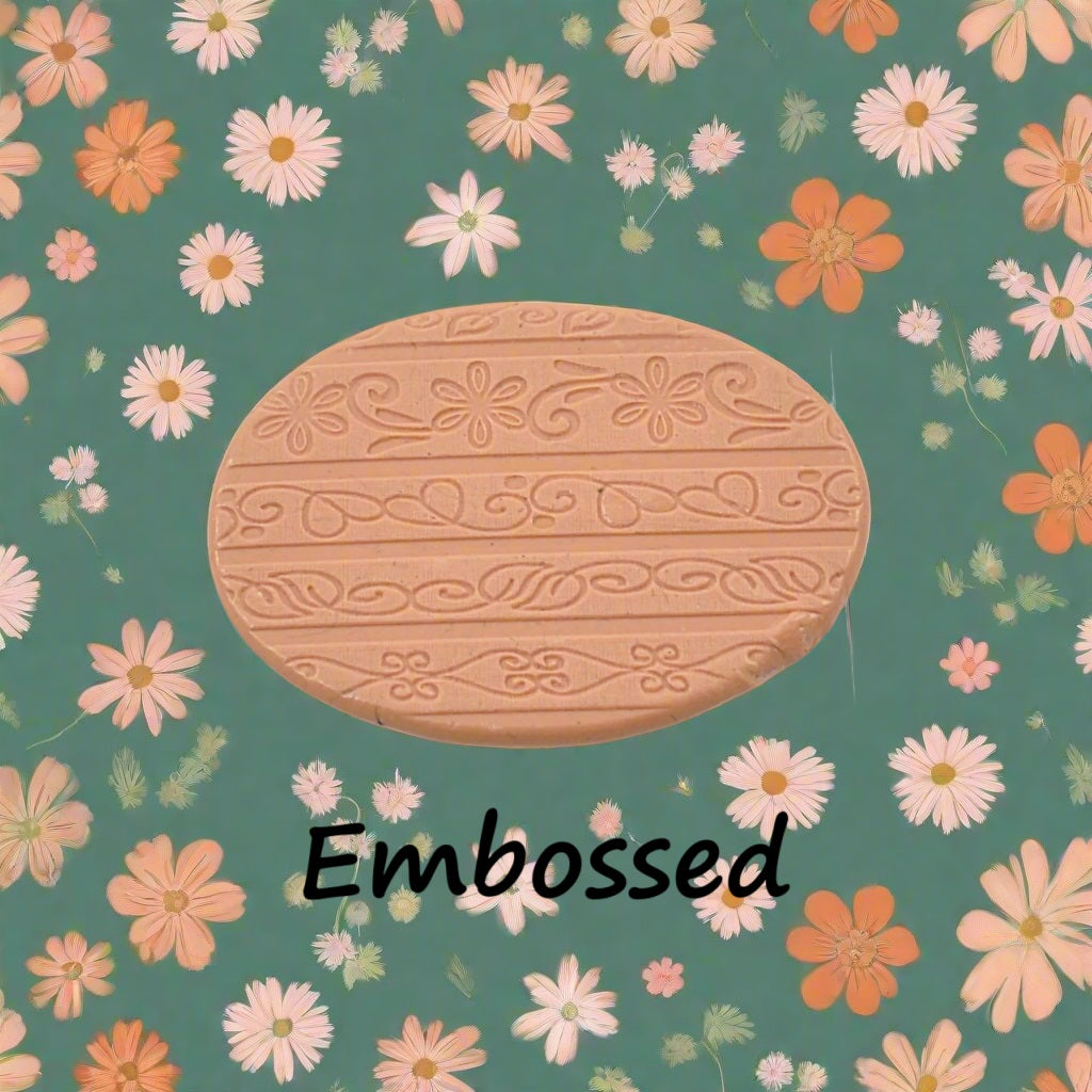 flowery patterns debossed in silly putty Using an embossed texture mat.. This will give you an idea of what it will look like on metal clay or polymer clay.