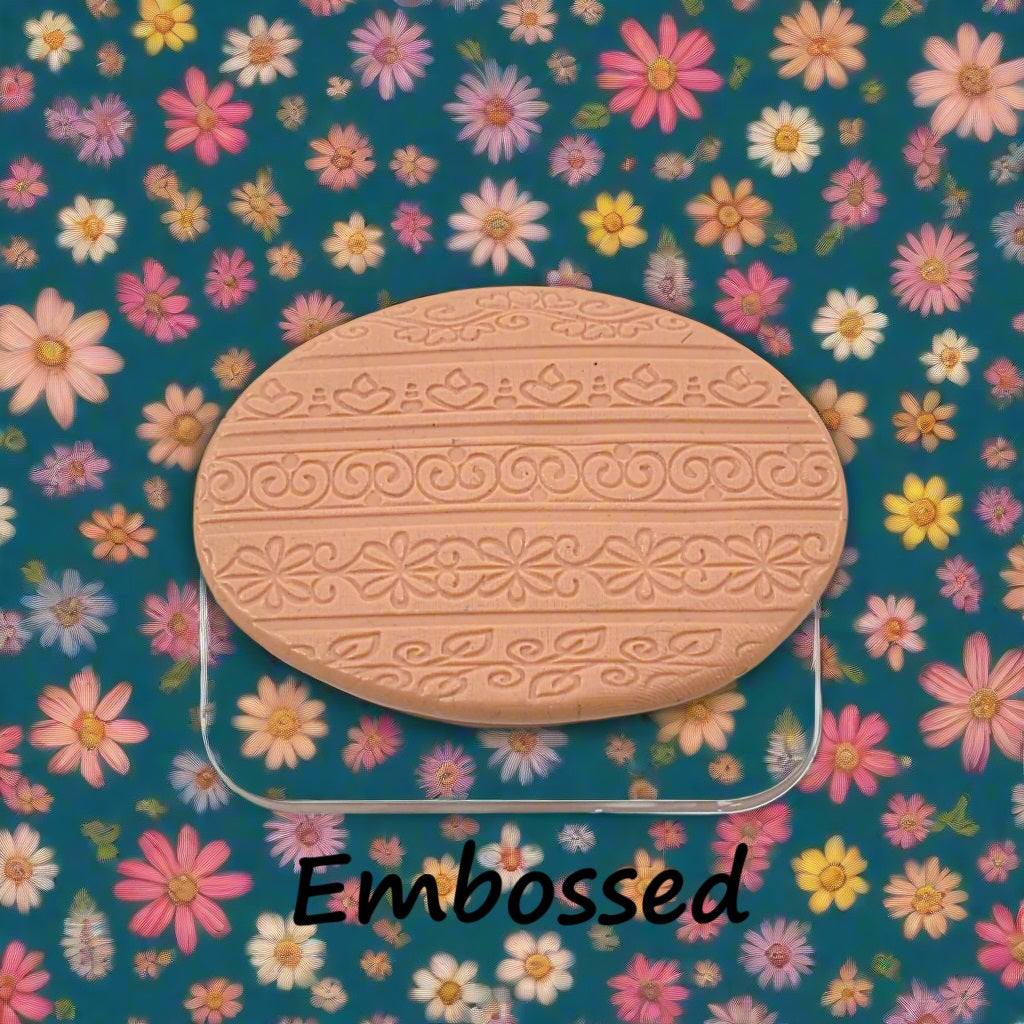 flowery patterns debossed in silly putty Using an embossed texture mat.. This will give you an idea of what it will look like on metal clay or polymer clay.