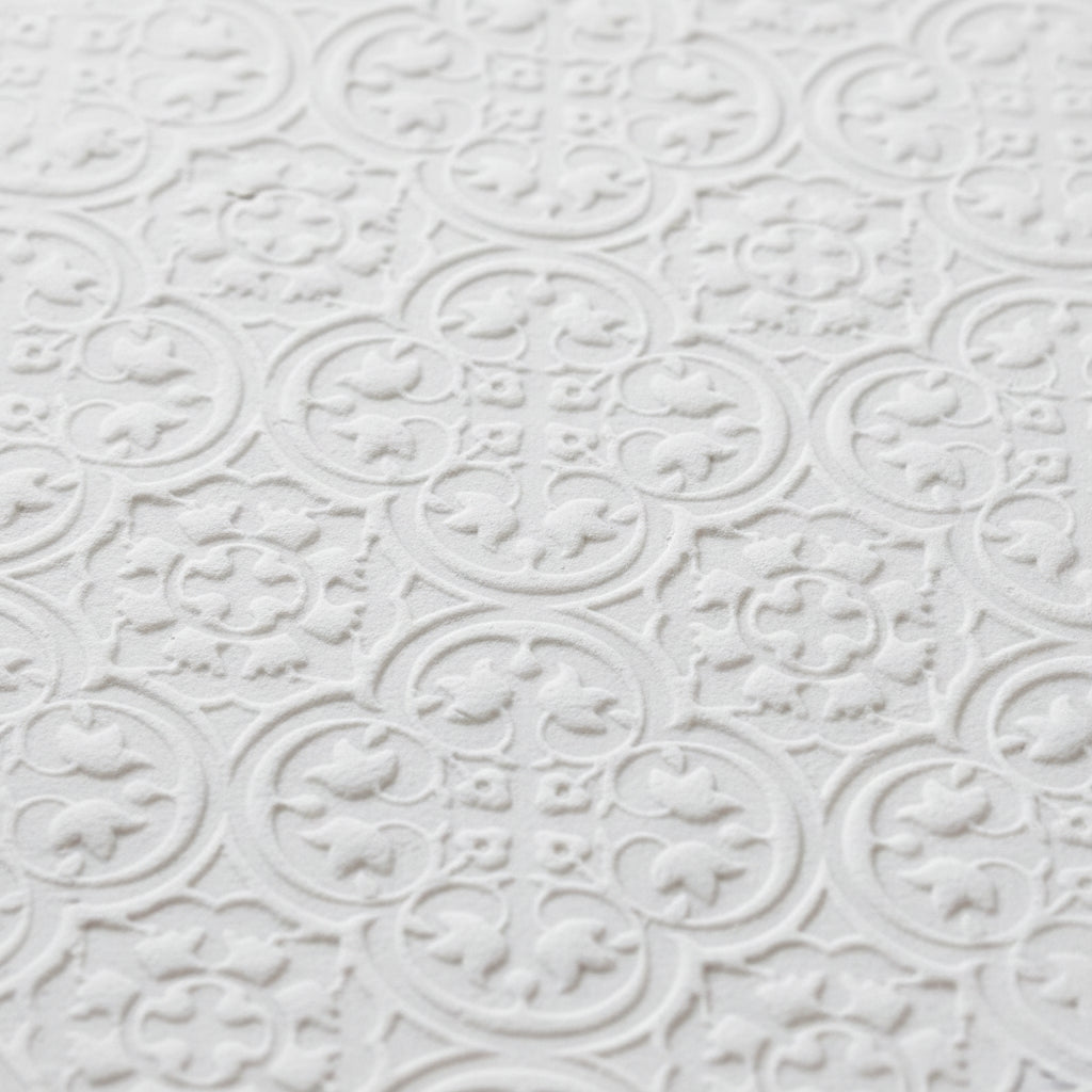 white textured geometric pattern using a geometric texture roller.