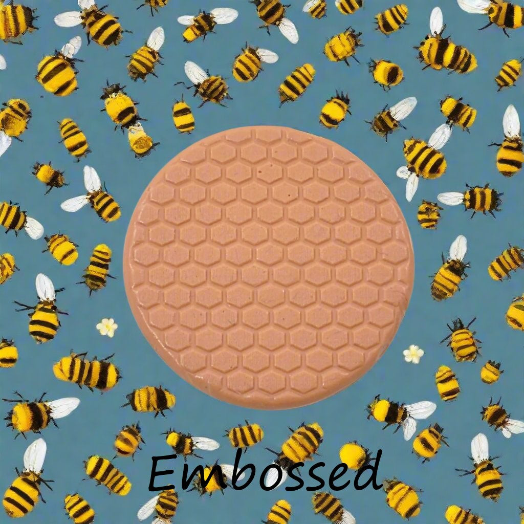 honey comb design debossed in silly putty Using an embossed texture mat. This will give you an idea of what it will look like on metal clay or polymer clay