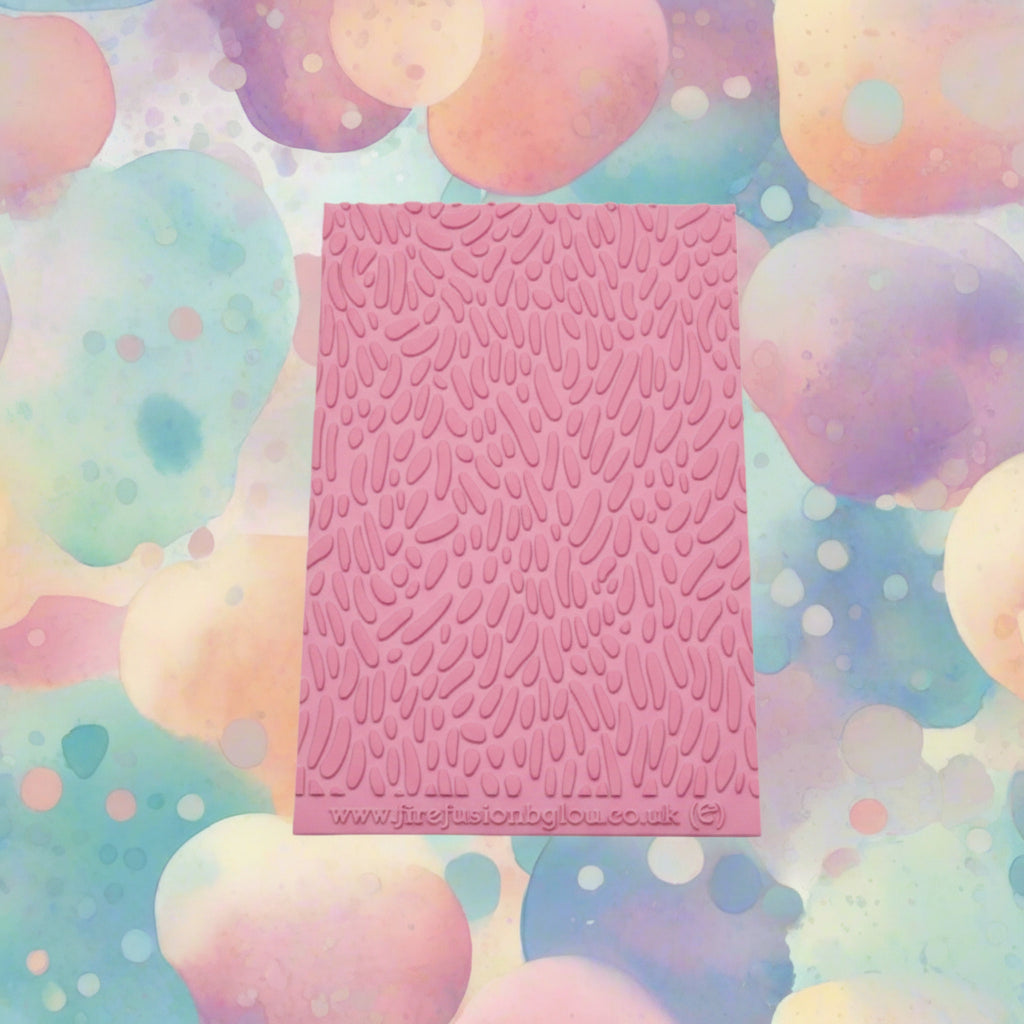 A Jelly bean pattern embossed texture mat. This texture mat will give you a debossed effect on metal clay or polymer clay.