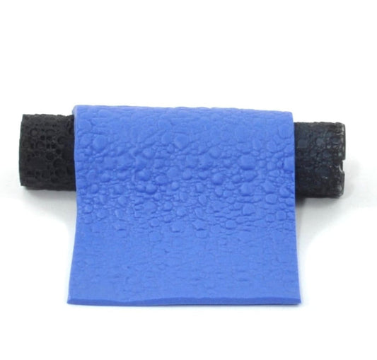 Blue textured polymer cobblestones on a white background