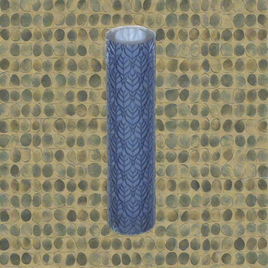 A cylindrical textured roller with a repeating pattern of leaves, displayed against a textured background.