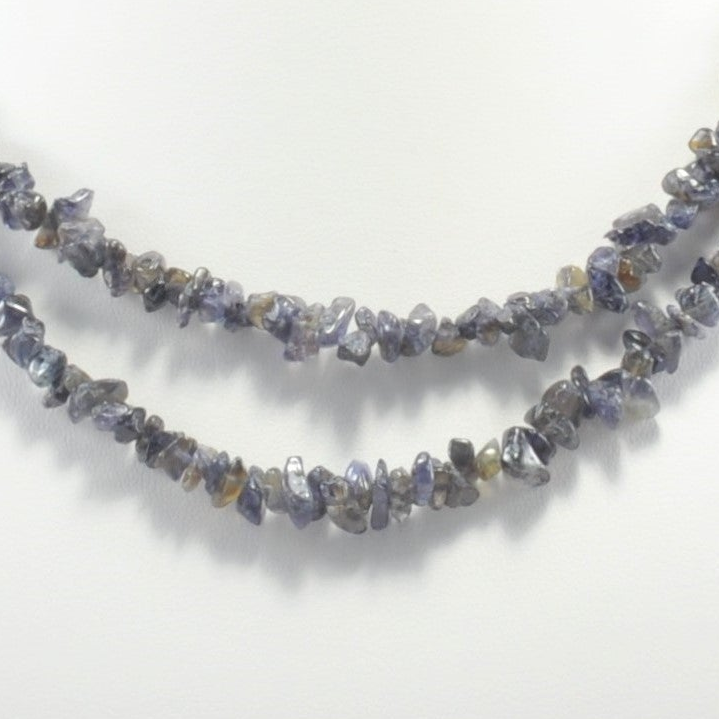Necklace with small, irregularly shaped stones on a white background