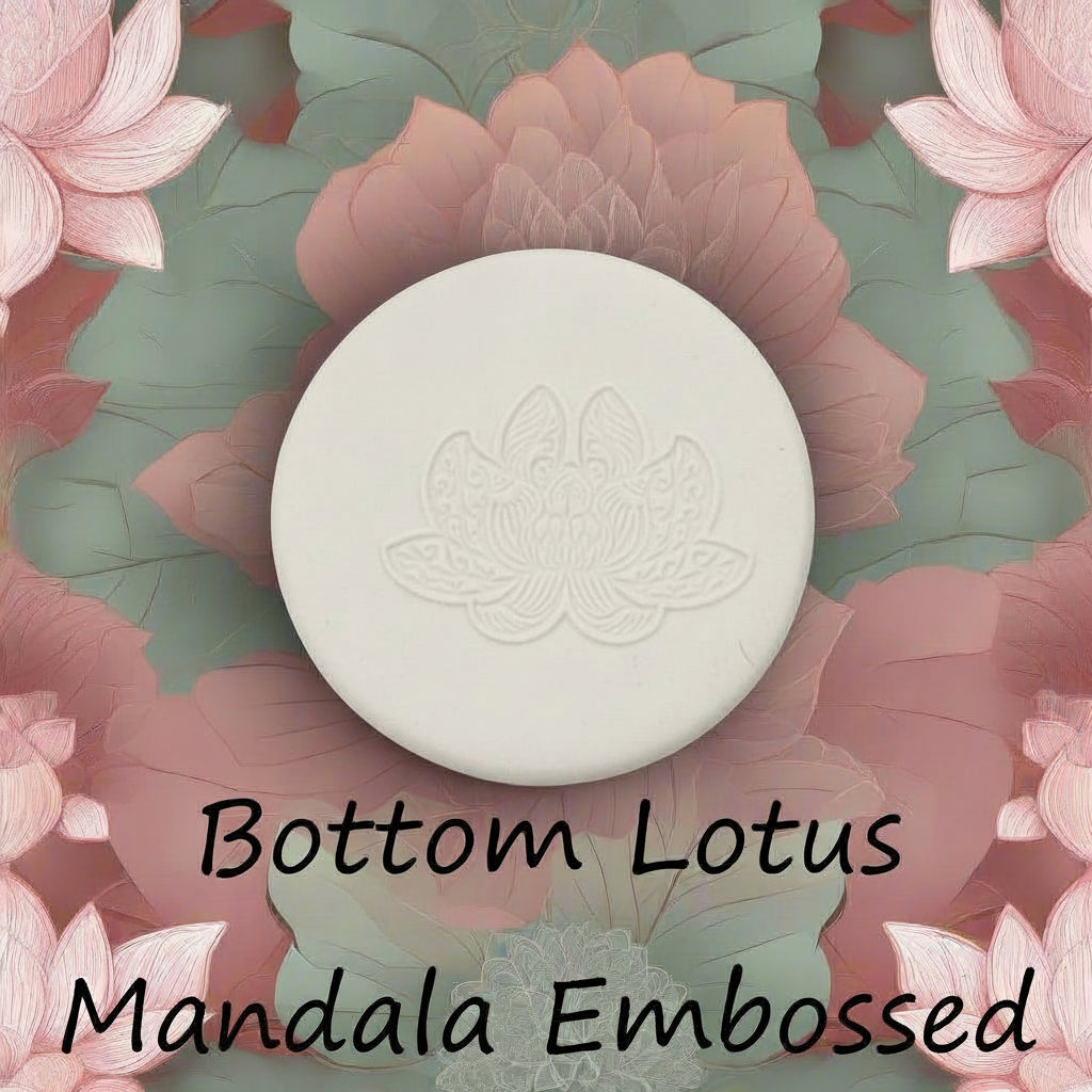 A lotus flower mandala debossed in clay Using a embossed texture mat.
