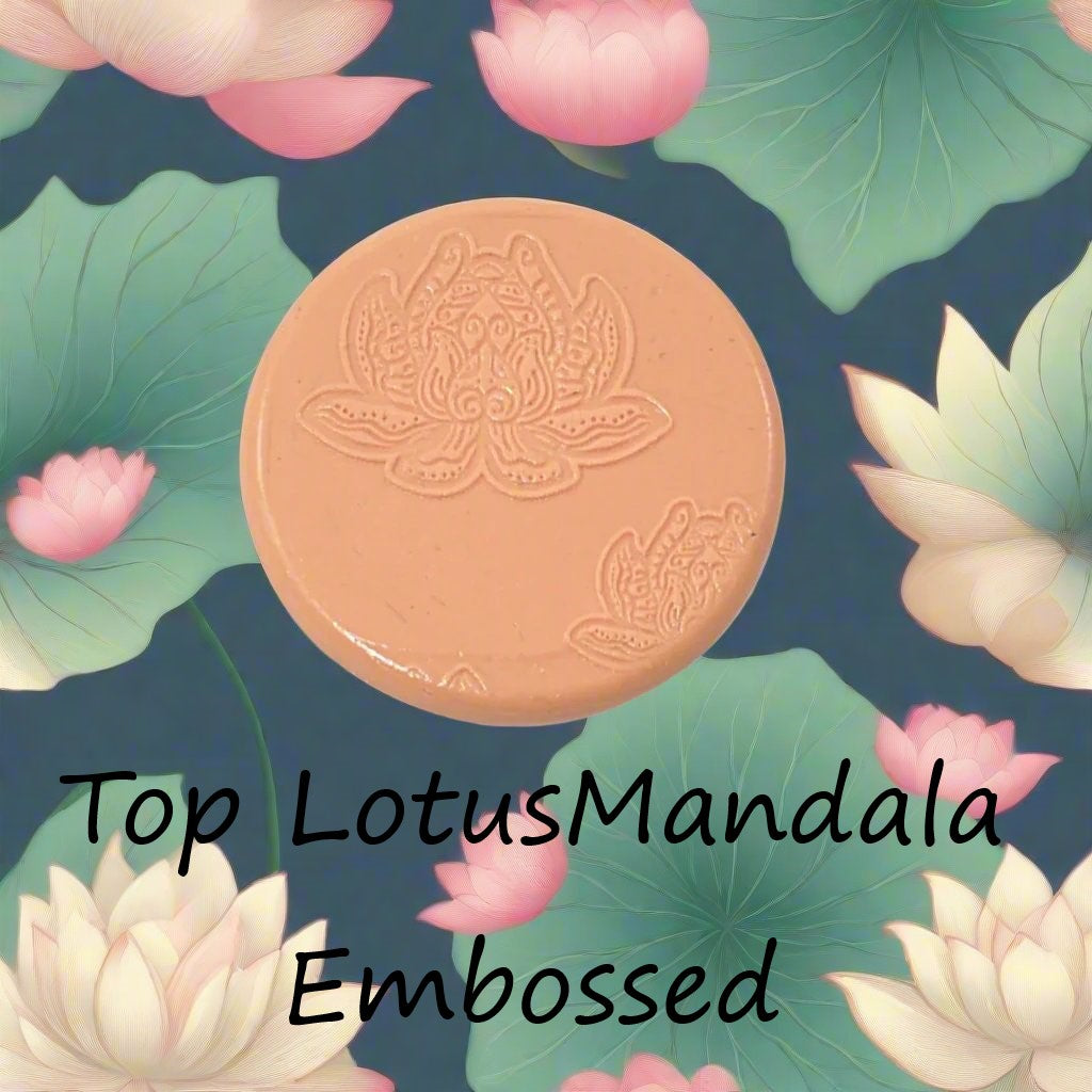 A lotus flower mandala debossed in silly putty Using a embossed texture mat in grey material. This will give you an idea of what it will look like on metal clay or polymer clay.
