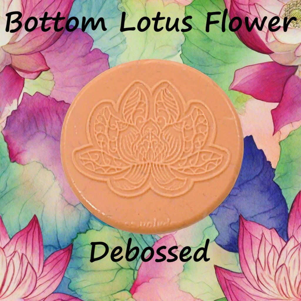 A lotus flower mandala embossed in silly putty Using a debossed texture mat in grey material. This will give you an idea of what it will look like on metal clay or polymer clay.