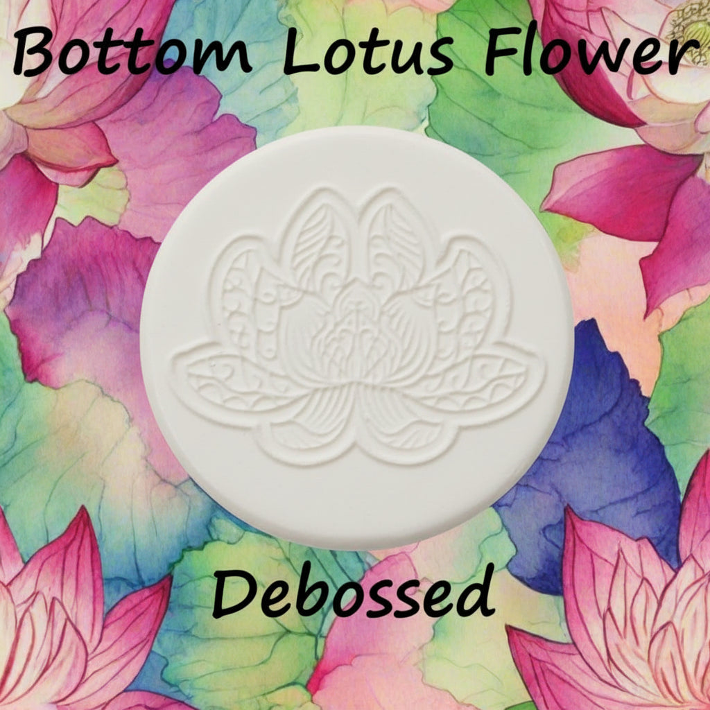 A lotus flower mandala embossed in clay using a debossed texture mat.