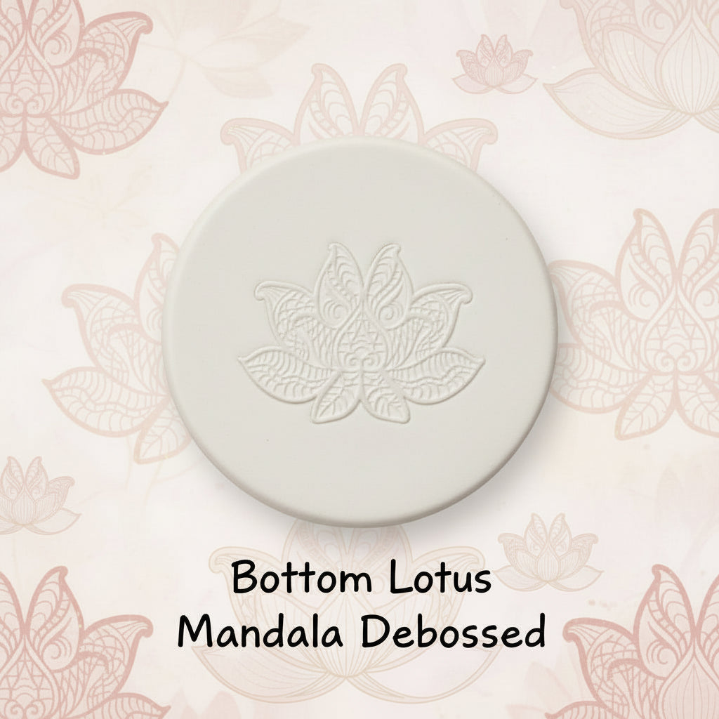 A lotus flower mandala embossed in clay using a debossed texture mat.