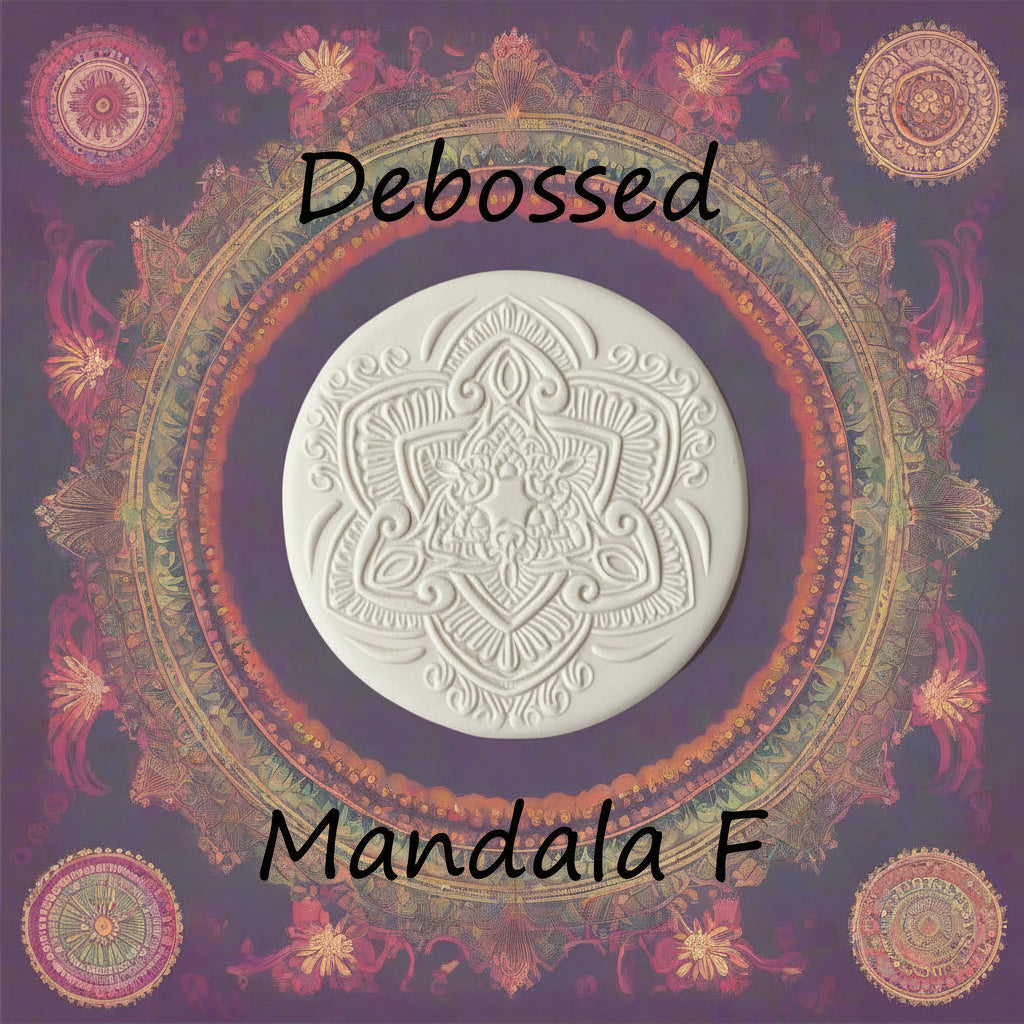 Debossed clay mandala with intricate patterns on a decorative background