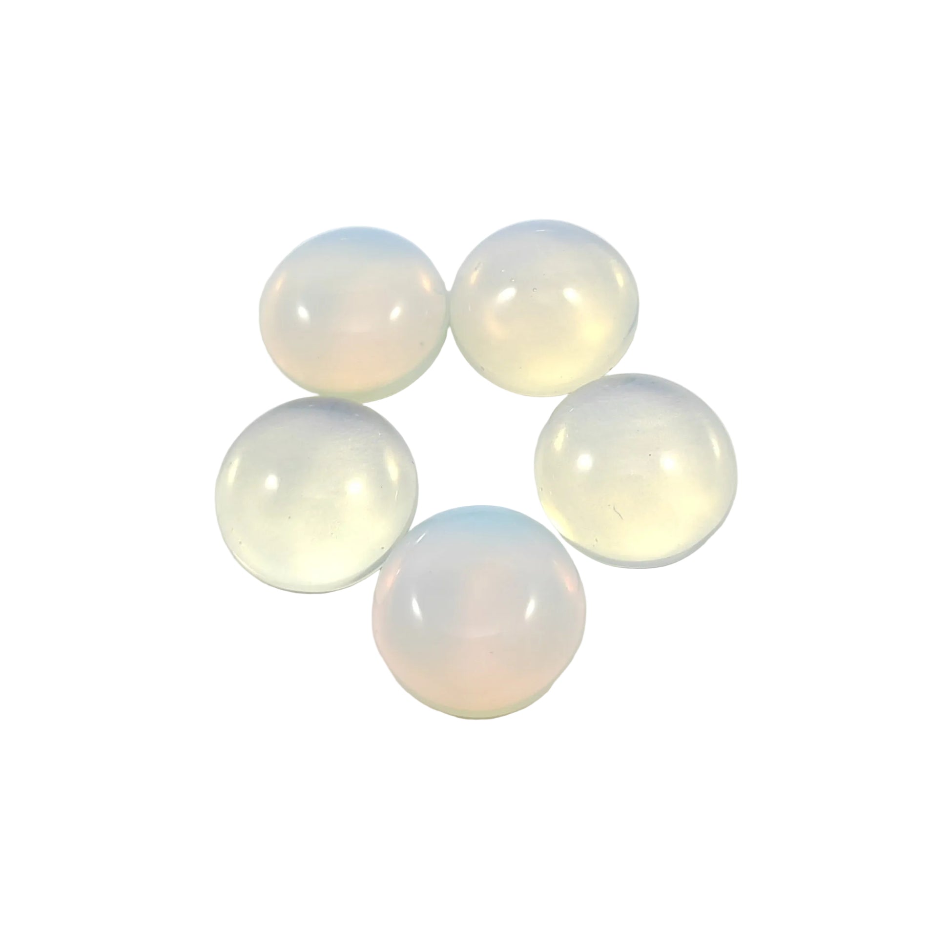 Five translucent glass cabochons on a white background