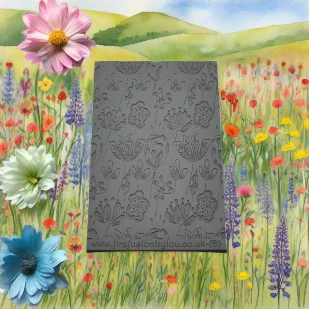 A 95 x 55 mm debossed texture mat with a flower design. Use to make a embossed impression on metal clay and polymer clay.