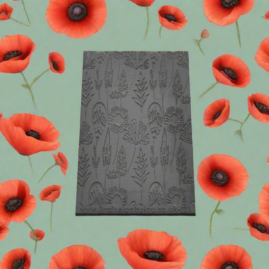 A 95 x 55 mm debossed texture mat with a flower design. Use to make a embossed impression on metal clay and polymer clay.