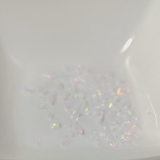 Fireable pink opal chips in a white dish