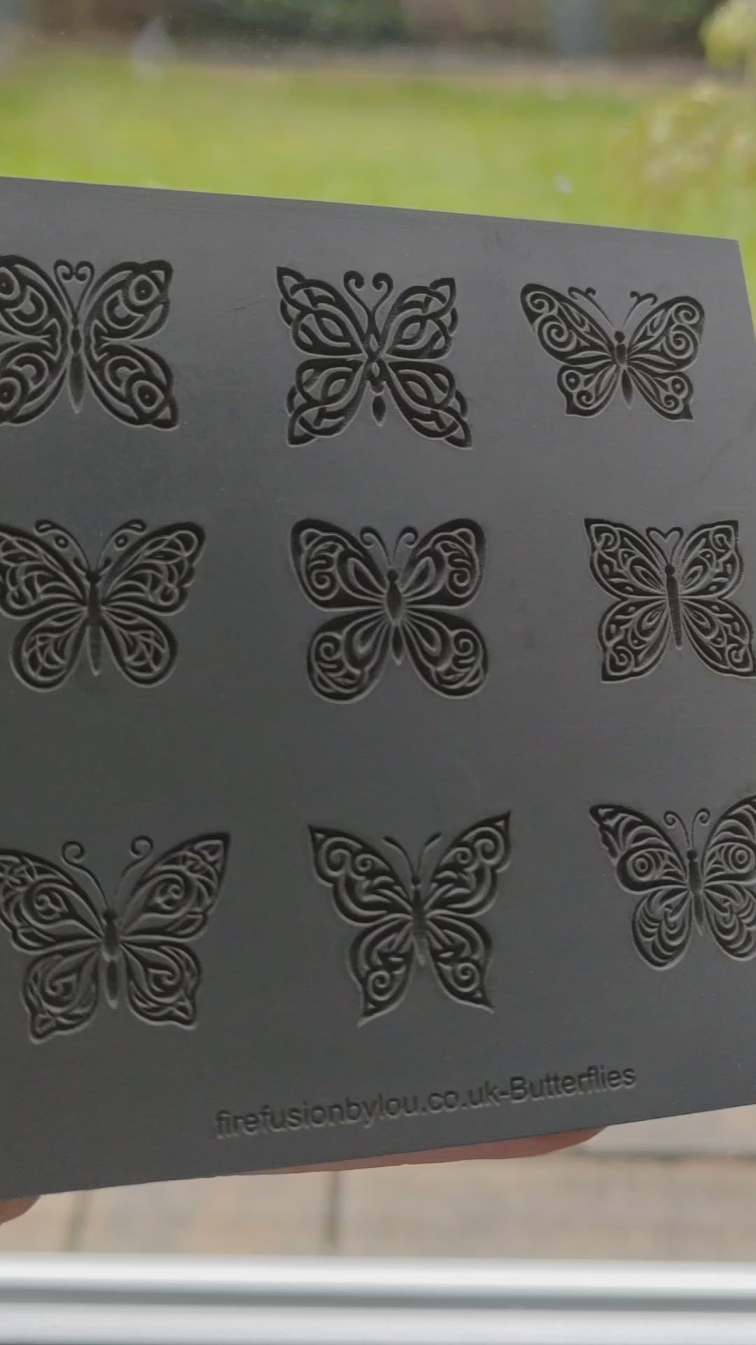 Nine butterfly textures debossed on grey rubber. Three rows of three. Pressed into metal clay to leave a debossed impression.