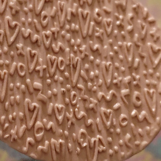 Embossed Heart patterns In Silly Putty