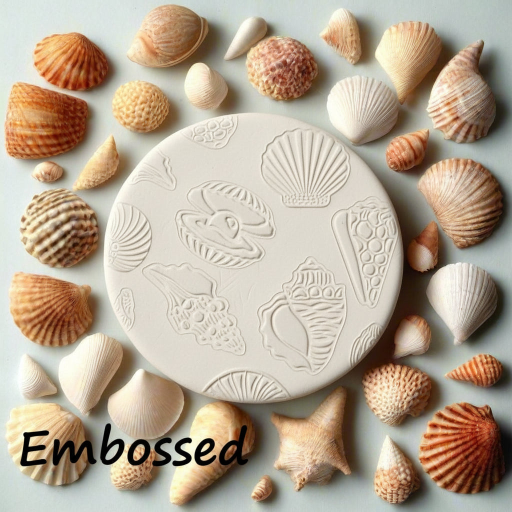 Seashells debossed in  clay using an embossed texture mat.  