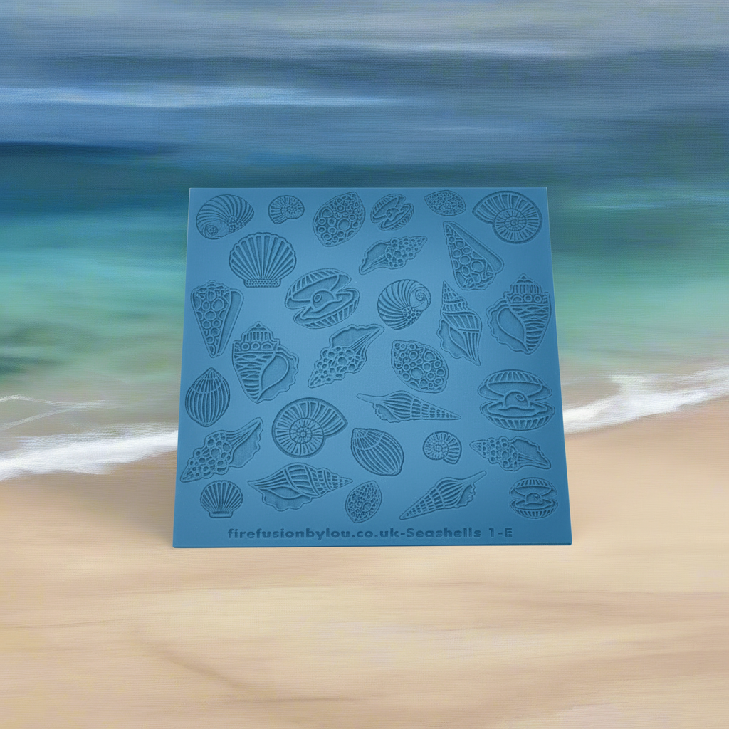 An embossed seashell texture mat with mirrored designs small and big, two sizes. use to make an impression on metal clay and polymer clay.