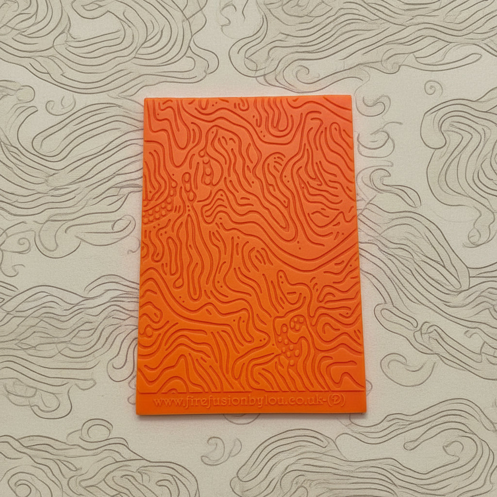 A pattern debossed texture mat. This texture mat will give you an embossed effect on metal clay or polymer clay.
