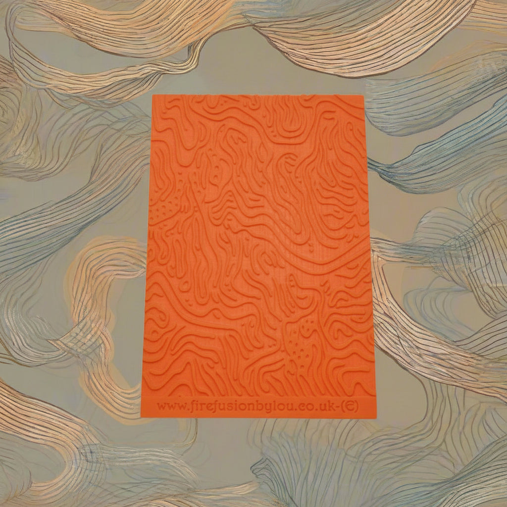 A pattern embossed texture mat. This texture mat will give you an embossed effect on metal clay or polymer clay.