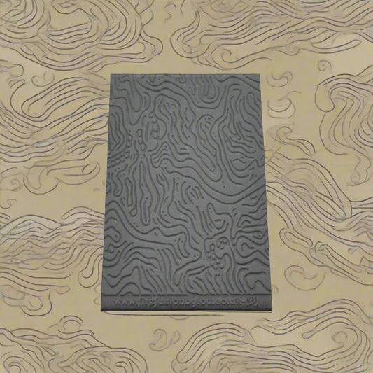 A pattern debossed texture mat in grey material. This texture mat will give you an embossed effect on metal clay or polymer clay.