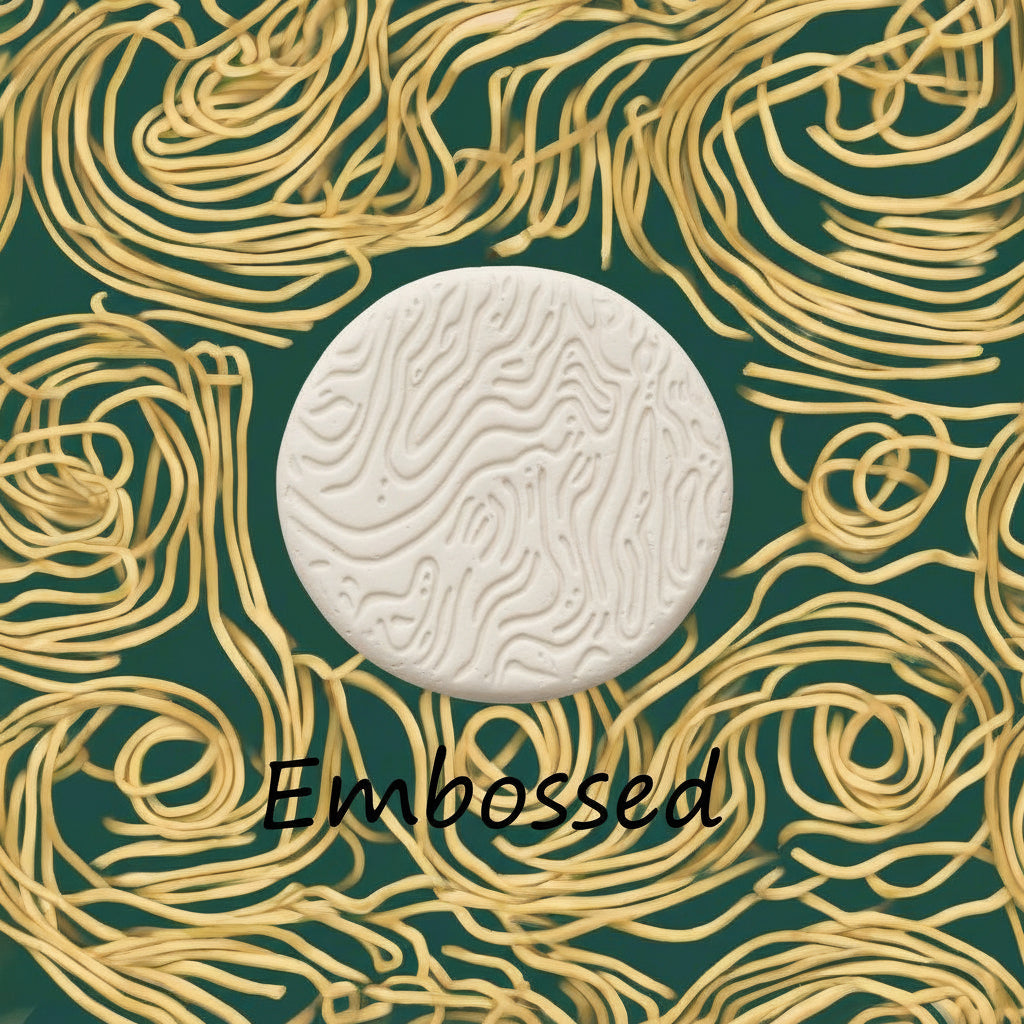 A pattern debossed in clay using a patterned embossed texture mat.