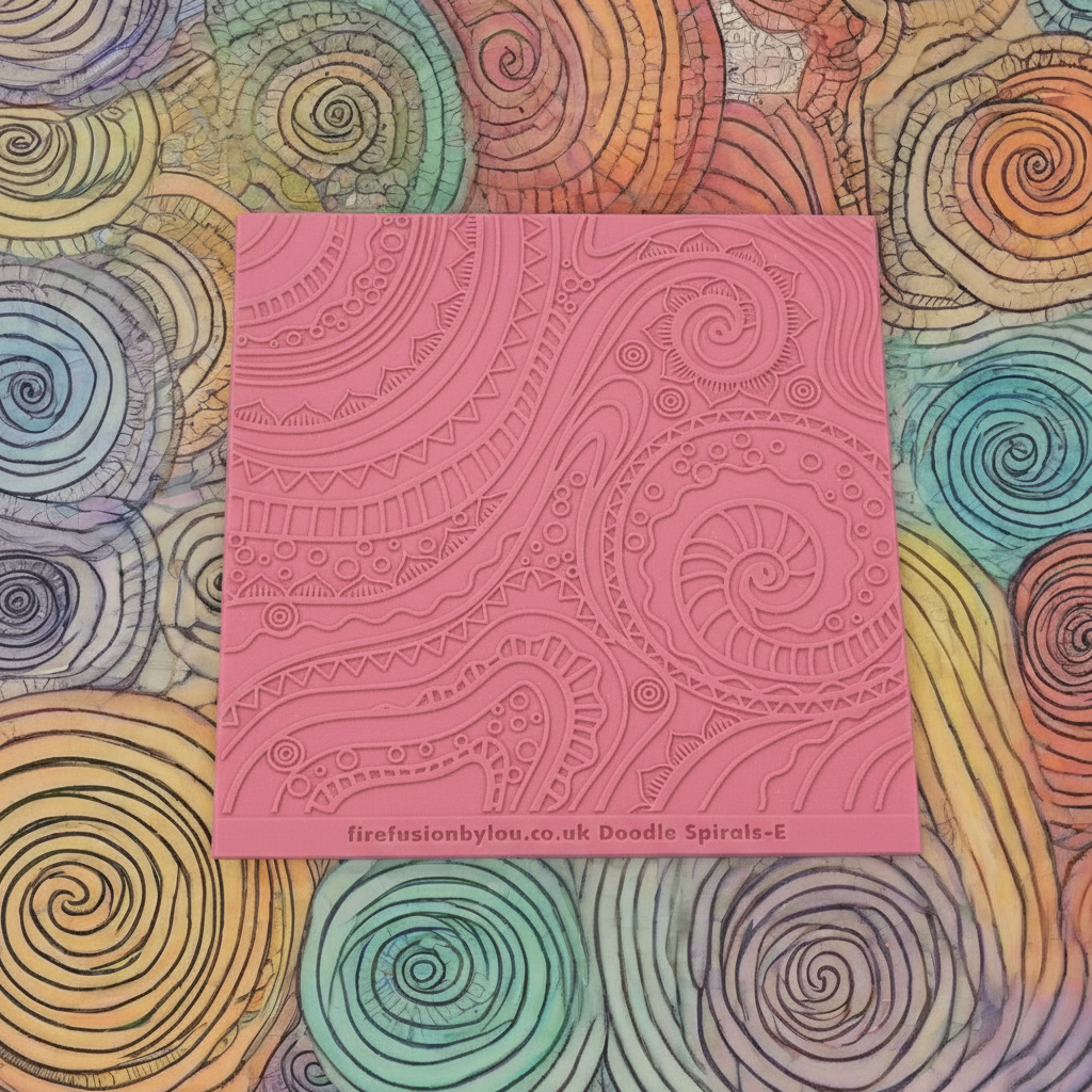 A pattern embossed texture mat. This texture mat will give you a debossed effect on metal clay or polymer clay.