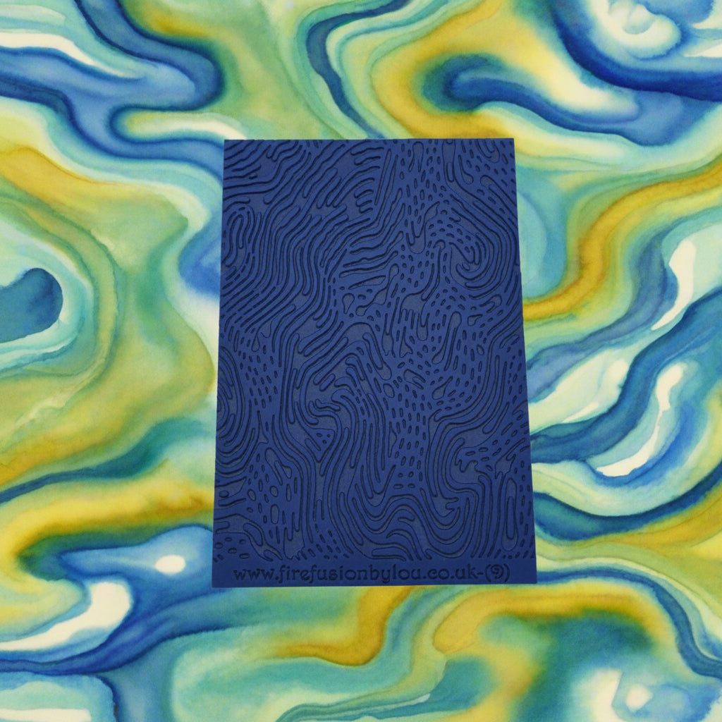 A pattern debossed texture mat. This texture mat will give you an embossed effect on metal clay or polymer clay.