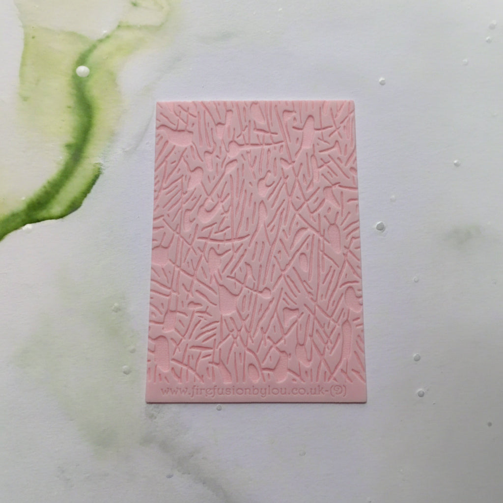 A pattern debossed texture mat. This texture mat will give you an embossed effect on metal clay or polymer clay.