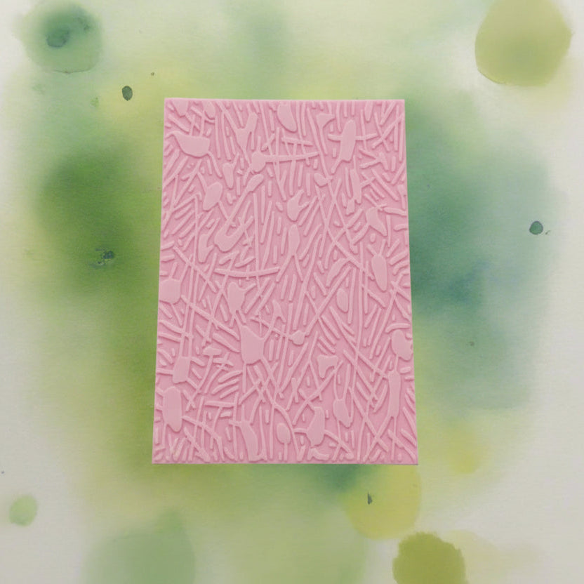 A pattern embossed texture mat. This texture mat will give you an debossed effect on metal clay or polymer clay.