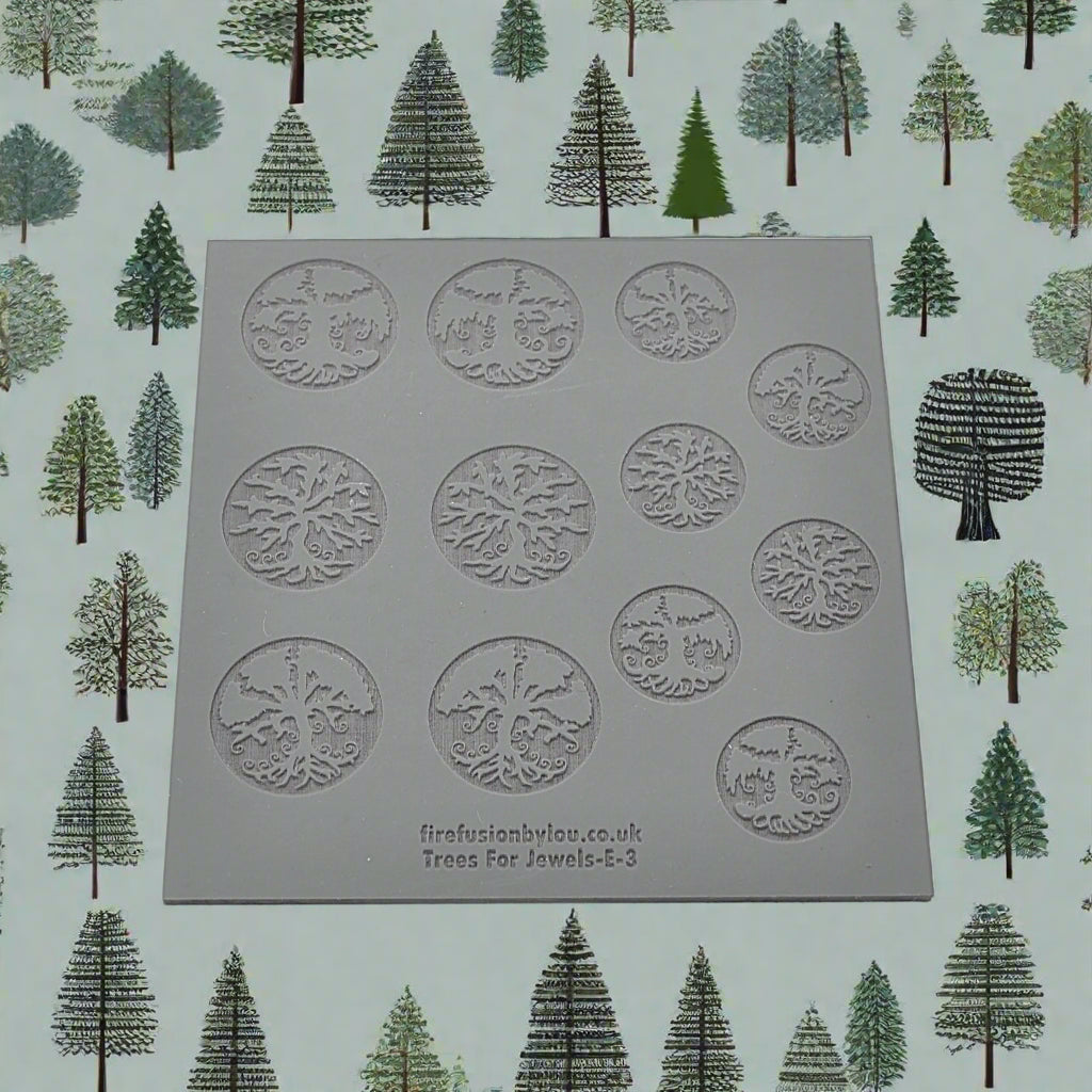 A 100 x 100 millimetre embossed texture mat with seven tree designs and two sizes. use to make an impression on metal clay and polymer clay.