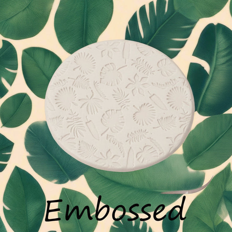 tropical leaves debossed in clay Using a  debossed texture mat. This will give you an idea of what it will look like on metal clay or polymer clay.