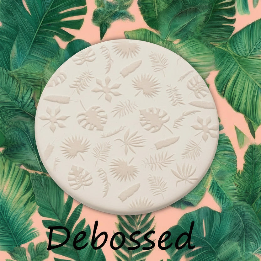tropical leaves embossed in clay Using a  debossed texture mat. This will give you an idea of what it will look like on metal clay or polymer clay.