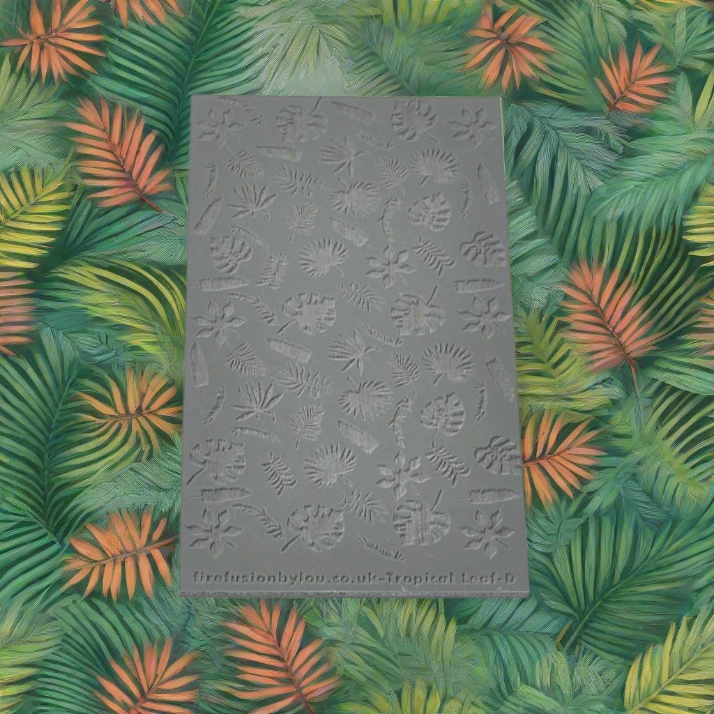 A 95 x 55 mm texture mat with with small tropical leaves in a repeat pattern. Use to make a embossed impression on metal clay and polymer clay.