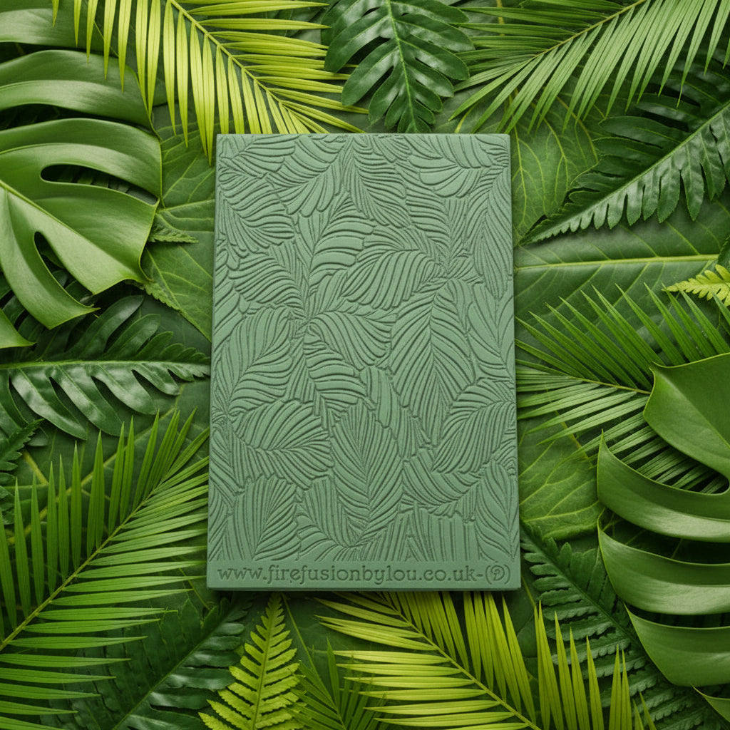 A 95 x 55 mm debossed texture mat with variegated leaves. Use to make a embossed impression on metal clay and polymer clay.